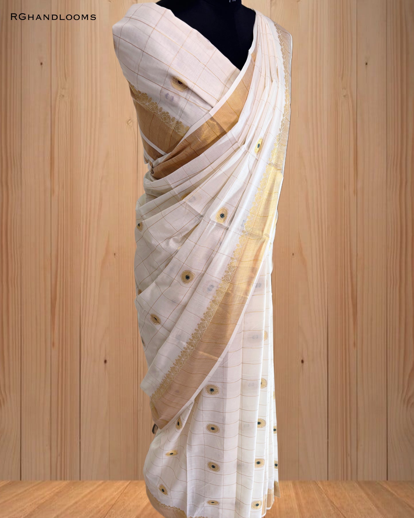 handloom saree featuring a classic checked design with green buttas