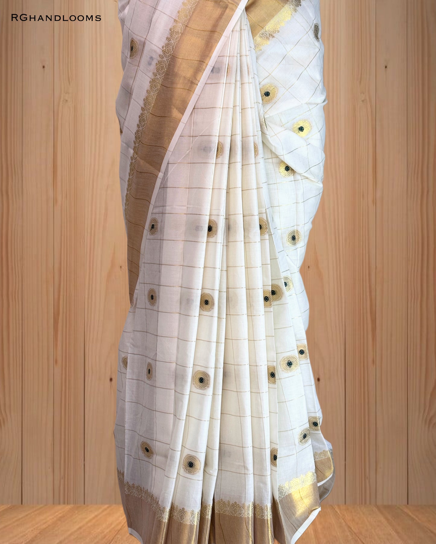 handloom saree featuring a classic checked design with green buttas