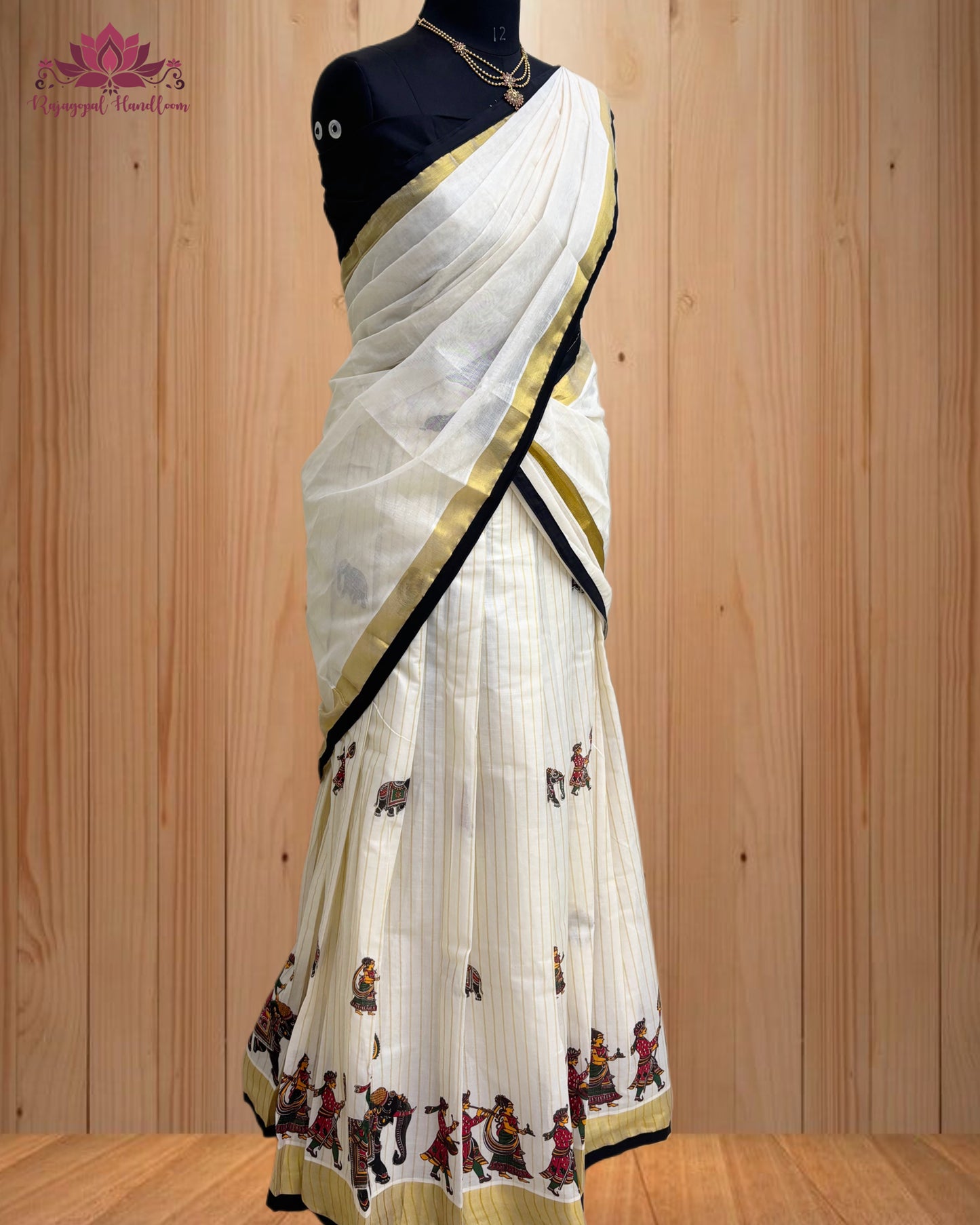 black and gold Dhawani set featuring a majestic elephant design.