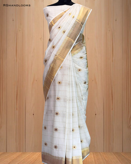 handloom saree featuring a timeless checked design paired with bold red buttas