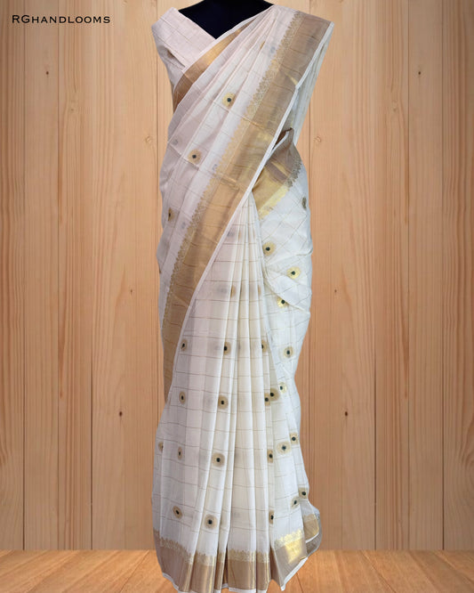 handloom saree featuring a classic checked design with green buttas