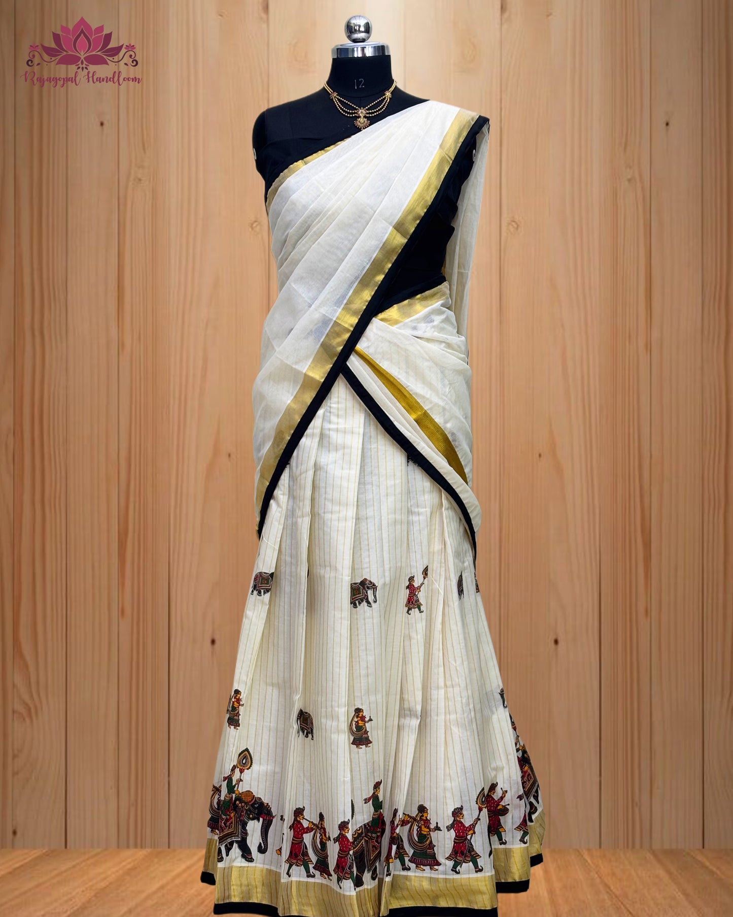 black and gold Dhawani set featuring a majestic elephant design.