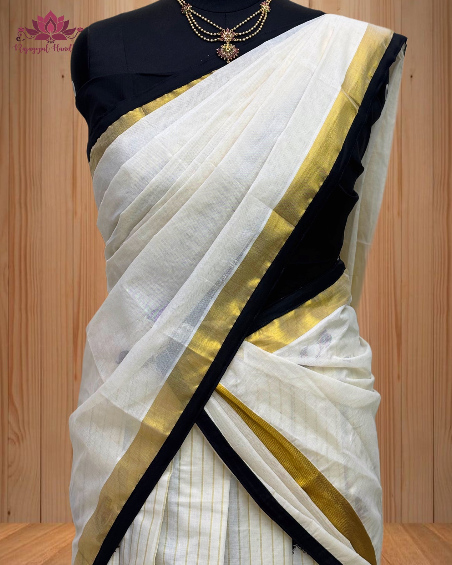 black and gold Dhawani set featuring a majestic elephant design.